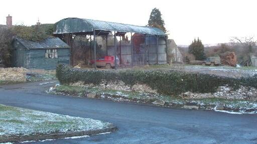 Dutch barn with corrugated iron roof, Fifield. This type of barn with a curved corrugated iron roof is often used for storage of hay. See Corrugated Iron Club website http://www.corrugated-iron-club.info/ironess2.html for more information.