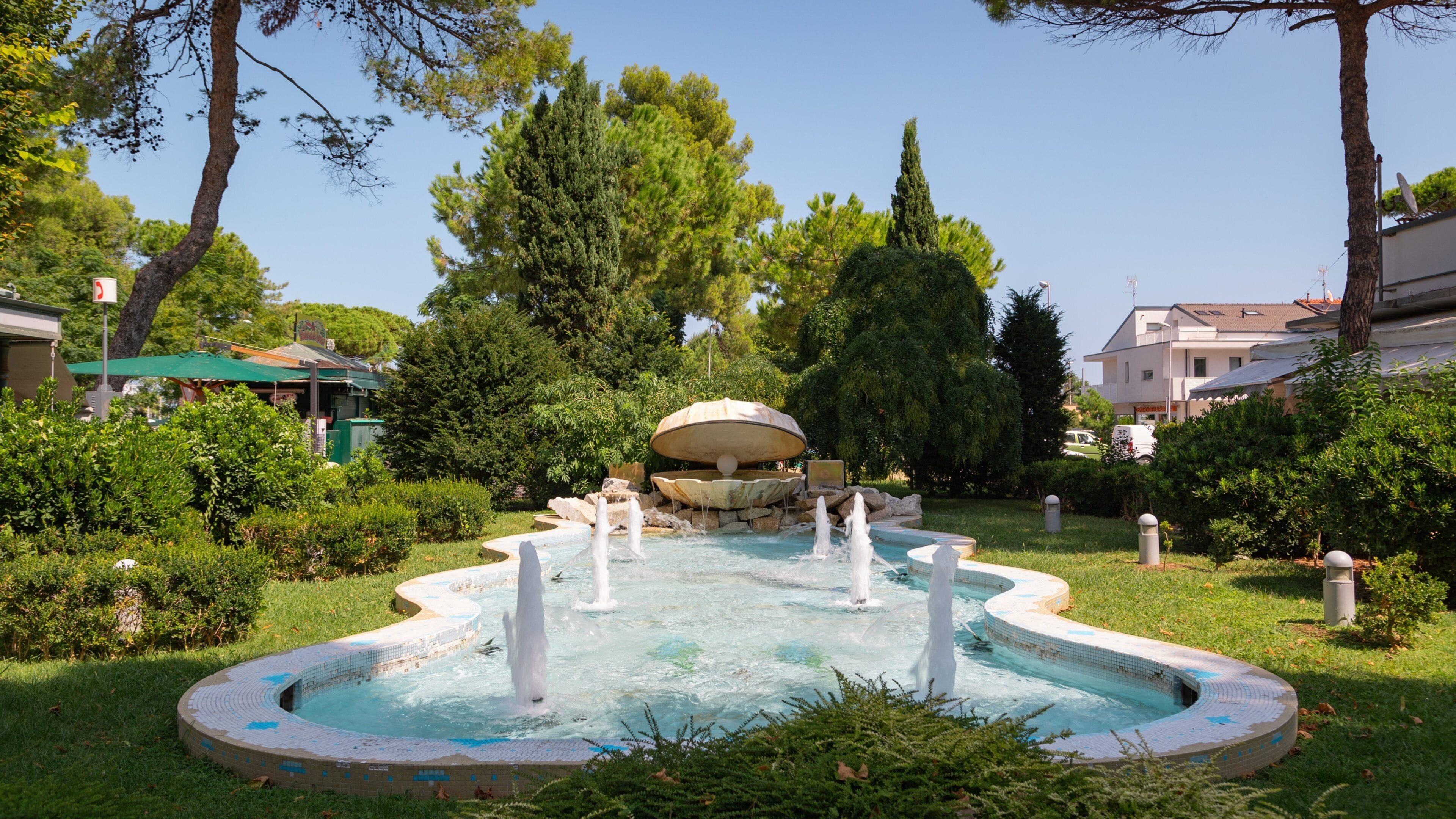Riccione featuring a park and a fountain