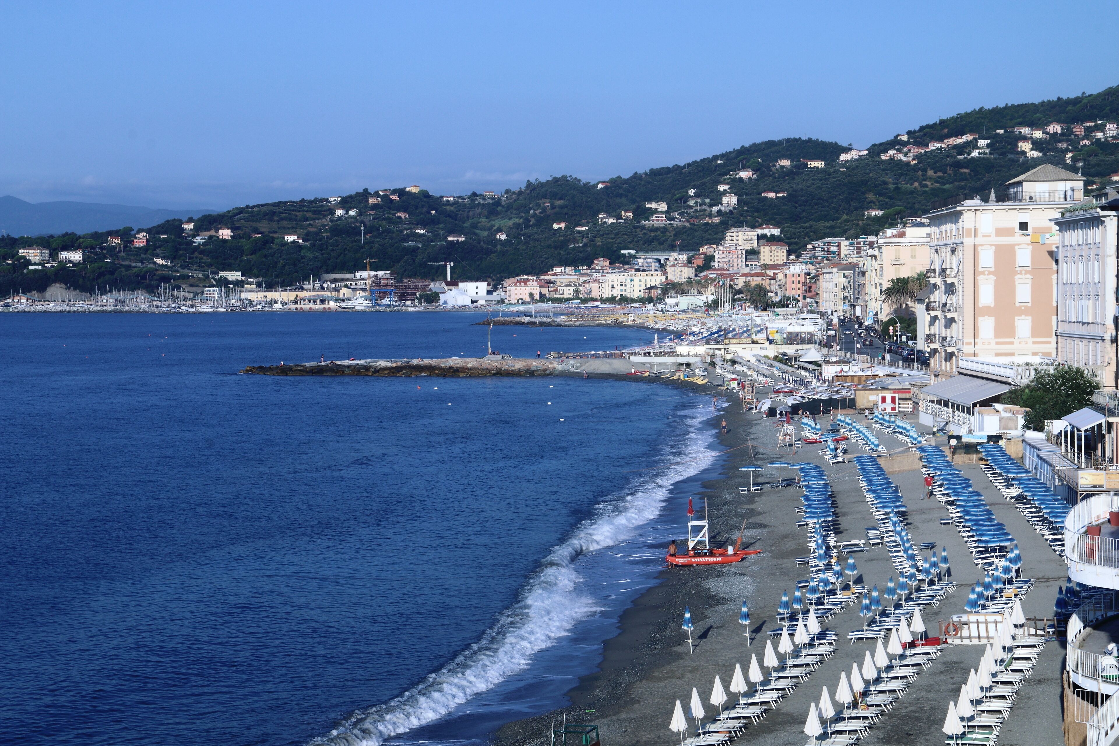 The beach and the houses of the Varazze promenade with the homonymous gulf in the background.Varazze is a town located in the western Ligurian Riviera, 30 kilometers from Genoa. 