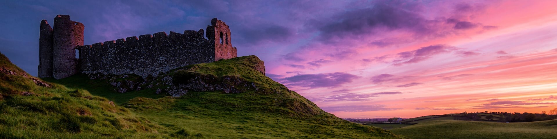 Another sunset: Roche Castle staring at relish and pinkish Sunset in County Louth, Ireland