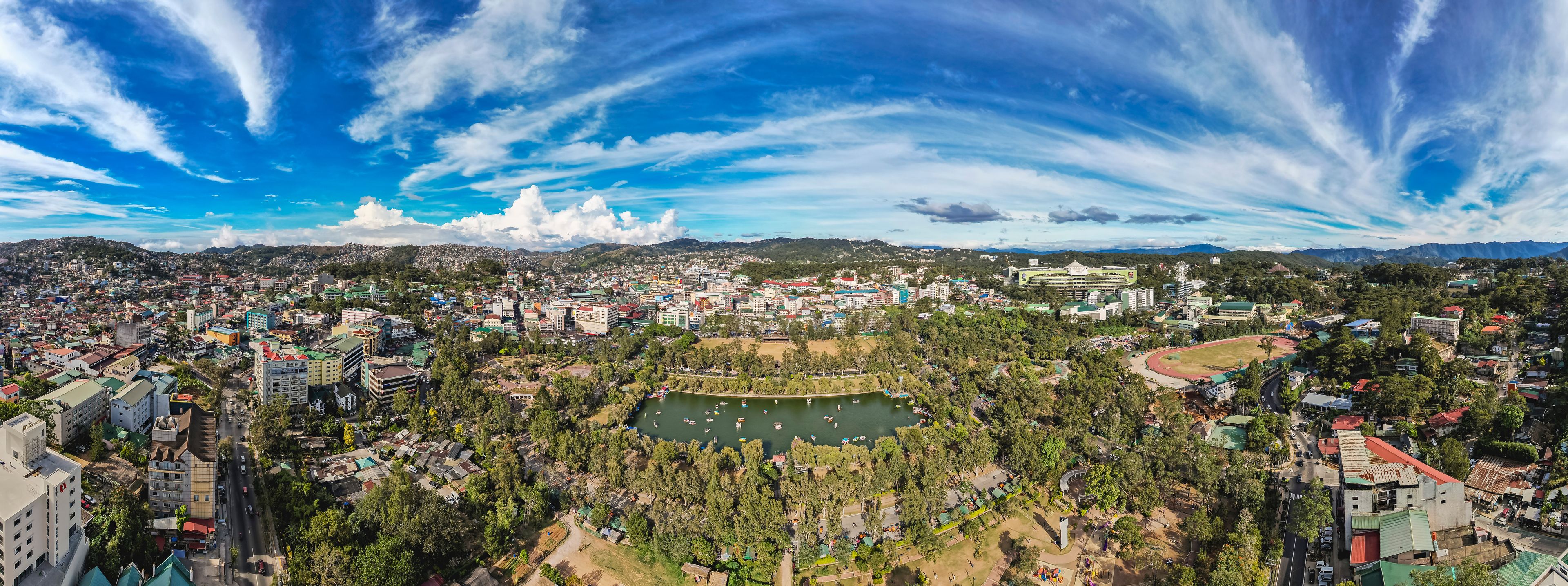 Baguio City, Philippines - Jan 2023: Panoramic aerial of Burnham Park and downtown Baguio.