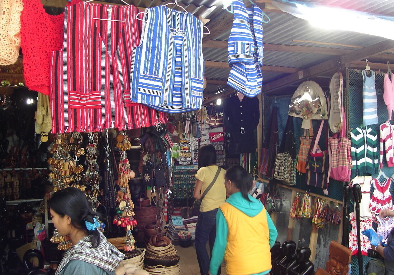 #market Located on an overlook that offers a panoramic vista of Benguet's gold and copper mine, the path leading to the observation desk, like any other tourist destination is filled with locals selling souvenirs, local products such as Peanut Brittles, Silver, brooms, traditional garments , wood sculptures done by local artisans. 