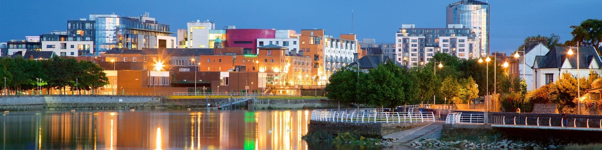 Limerick showing a river or creek, a city and night scenes