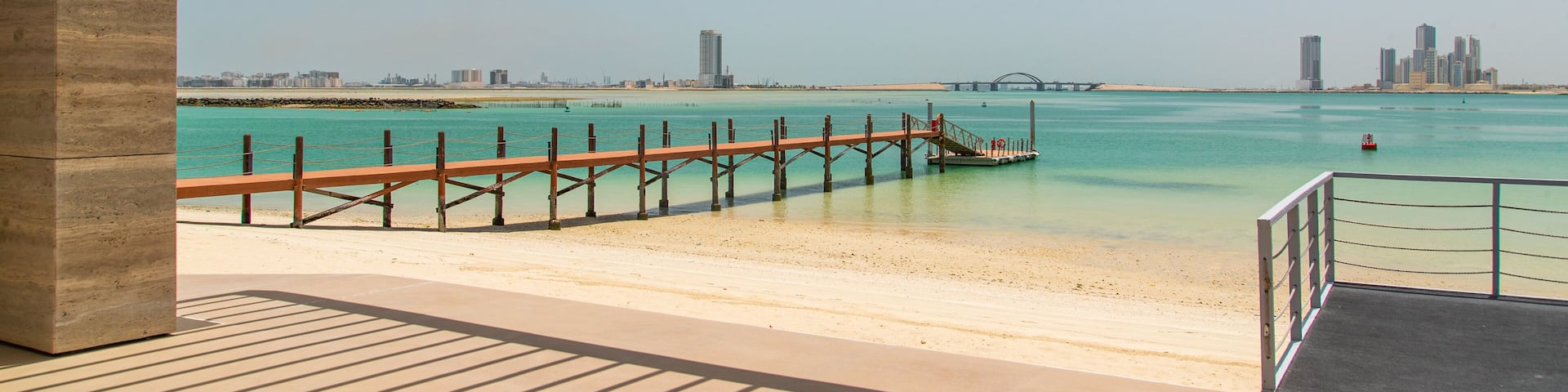 Manama showing tropical scenes, general coastal views and a beach