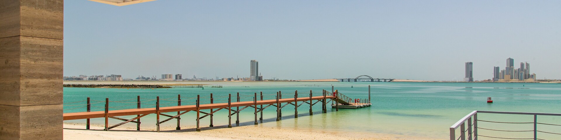 Manama showing tropical scenes, general coastal views and a beach