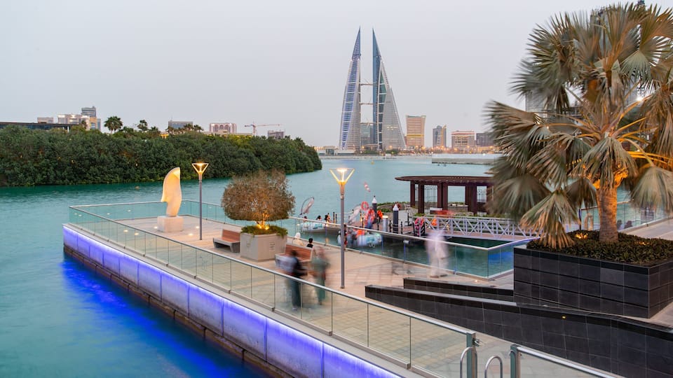 Manama which includes modern architecture, a high rise building and a bay or harbor