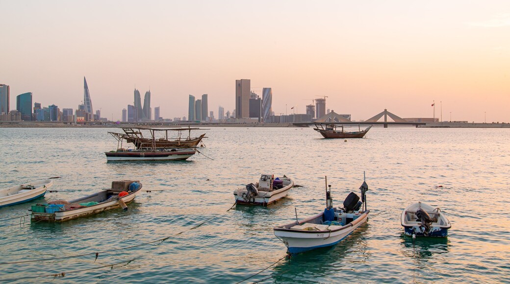 Manama showing a bay or harbor, a city and a sunset