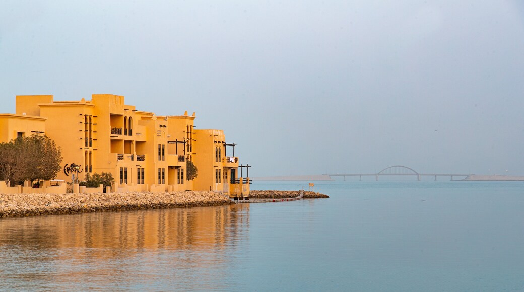 Manama showing a coastal town and general coastal views