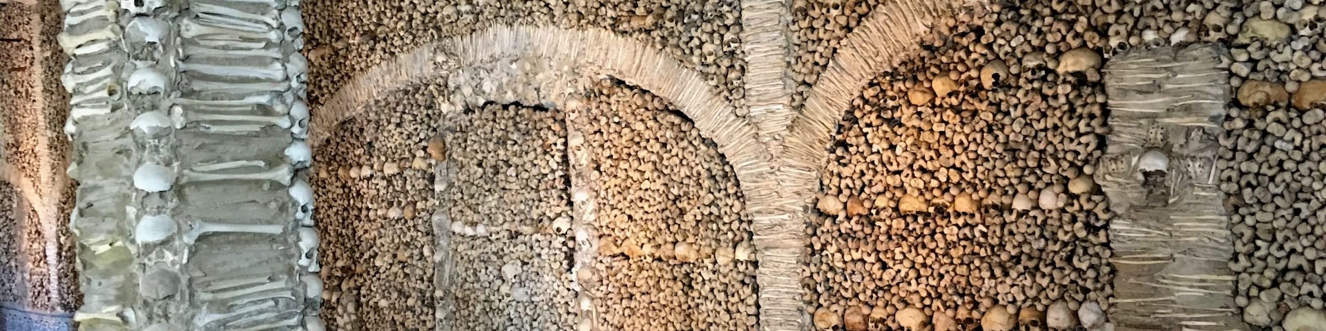 The Capela dos Ossos is one of the best known monuments in Évora, Portugal. It is a small interior chapel located next to the entrance of the Church of St. Francis.