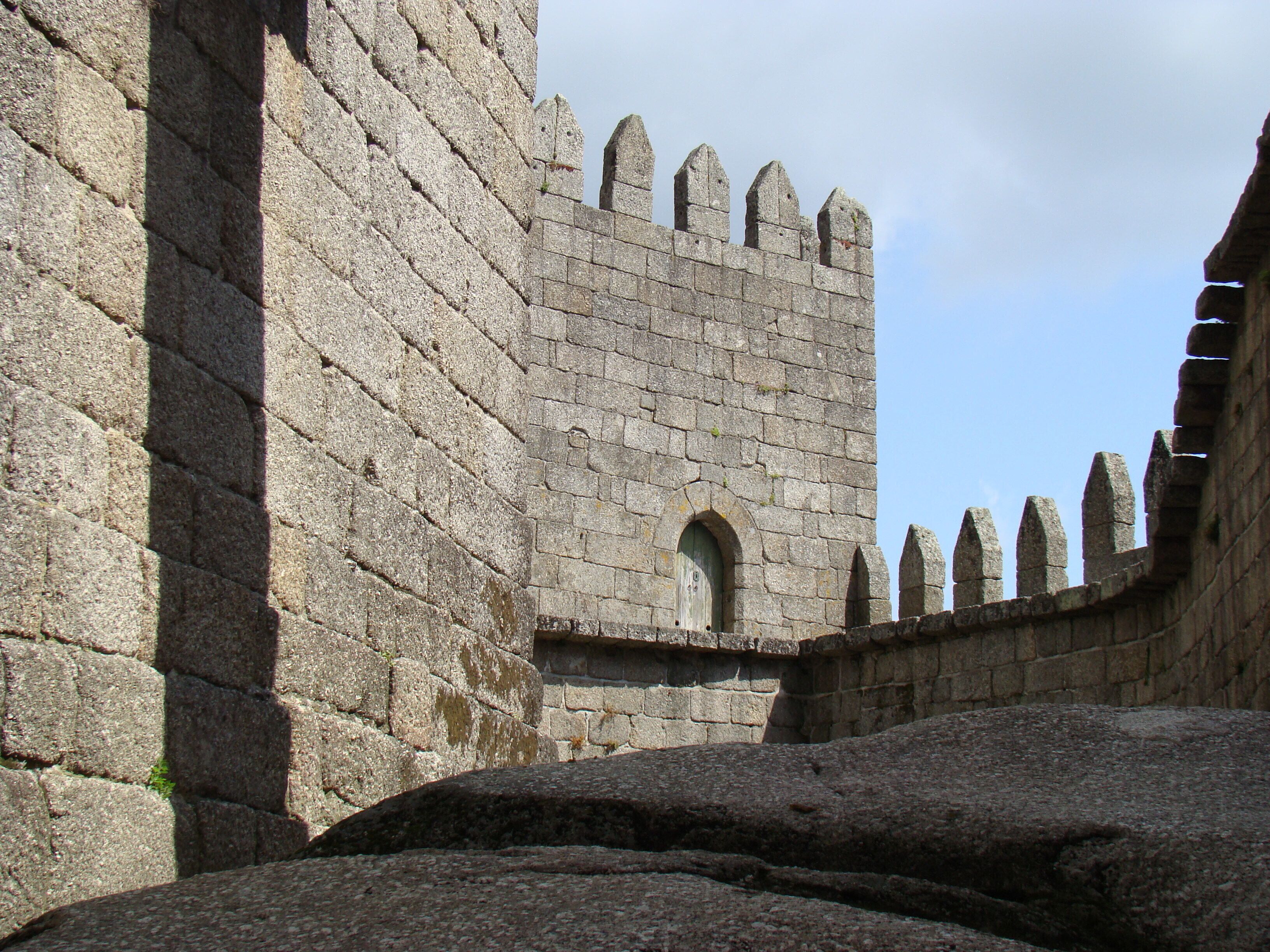 #Castelo #castle #Guimaraes #Portugal #History

O Castelo de Guimarães começou por um mosteiro mandado construir por Mumadona Dias no século X, antes, portanto, da formação de Portugal. Como os ataques dos mouros eram frequentes decidiram construir uma muralha para proteger a comunidade e os monges que viviam no seu interior. Foi esta fortaleza que deu origem ao Castelo de Guimarães. Mais tarde, no século XII, foi neste castelo que nasceu Dom Afonso Henriques que viria a ser o primeiro rei de Portugal. Com a falta de uso o castelo foi-se degradando. Recentemente foi recuperado e classificado como Monumento Nacional. É também considerado Patrimônio Mundial pela UNESCO. Um lugar cheio de história e que foi berço de Portugal. Não é à toa que em um pedaço da muralha original tem os dizeres “Aqui nasceu Portugal”.

The Castle of Guimarães began with a monastery built by Mumadona Dias in the 10th century, before, therefore, the formation of Portugal. As the attacks of the Moors were frequent they decided to build a wall to protect the community and the monks that lived inside. It was this fort that gave origin to the Castle of Guimarães. Later, in the twelfth century, it was in this castle that Dom Afonso Henriques was born. Some years after he would become the first king of Portugal. With the lack of use the castle was degrading. Recently it was recovered and classified as National Monument. It is also considered World Heritage by UNESCO. A place full of history and that was cradle of Portugal. It is no wonder that in a piece of the original wall has the words "Here was born Portugal".