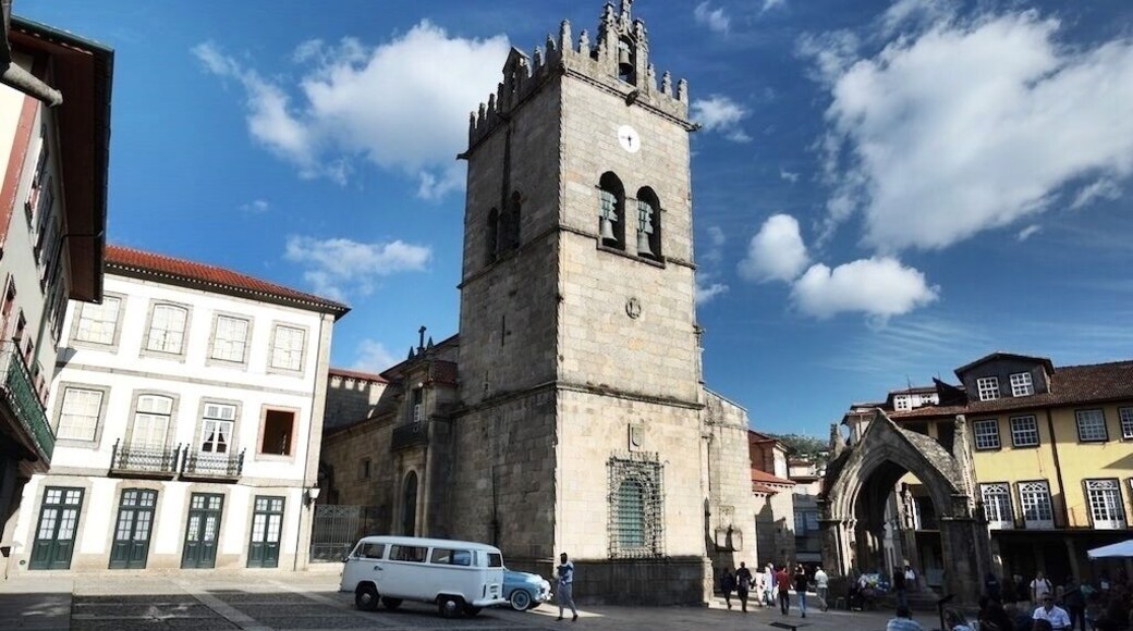 Igreja de Nossa Senhora da Oliveira is a collegiate church in Guimarães, Portugal. It is classified as a National Monument. Iconic carvings and art found within this intimate and beautiful Church, with a Romanesque arched nave. Situated on the Largo da Oliveira Square, this is all that remains of the Monastery that the Castelo de Guimaraes was built to defend. The current church's cornerstone was laid 1/1/1384. The bell tower is in the Manueline style, and the Gothic Padrao do Salado Shrine presides over its entrance
