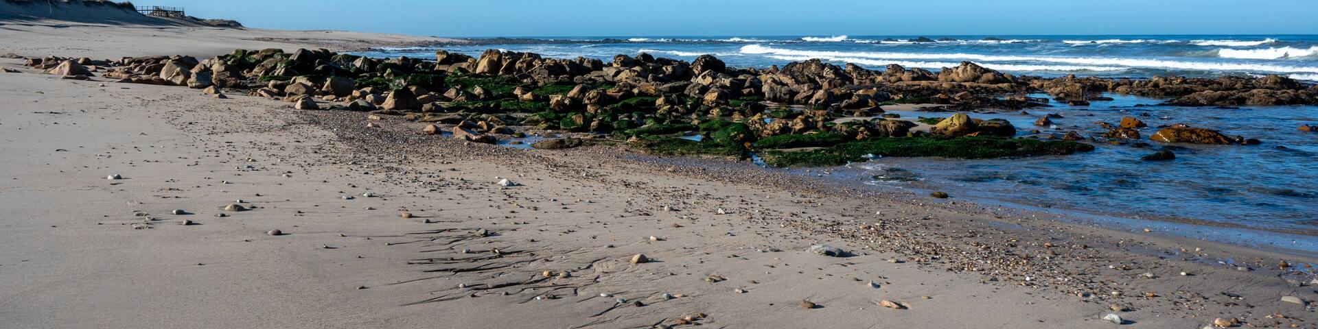 Praia de Canide, Canide Beach, on northern coast of Portugal in Vila Nova de Gaia under dramatic autumn cloudscape.
