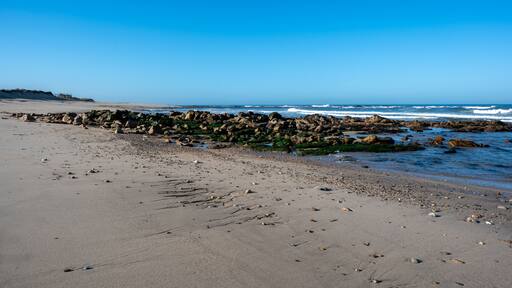 Praia de Canide, Canide Beach, on northern coast of Portugal in Vila Nova de Gaia under dramatic autumn cloudscape.