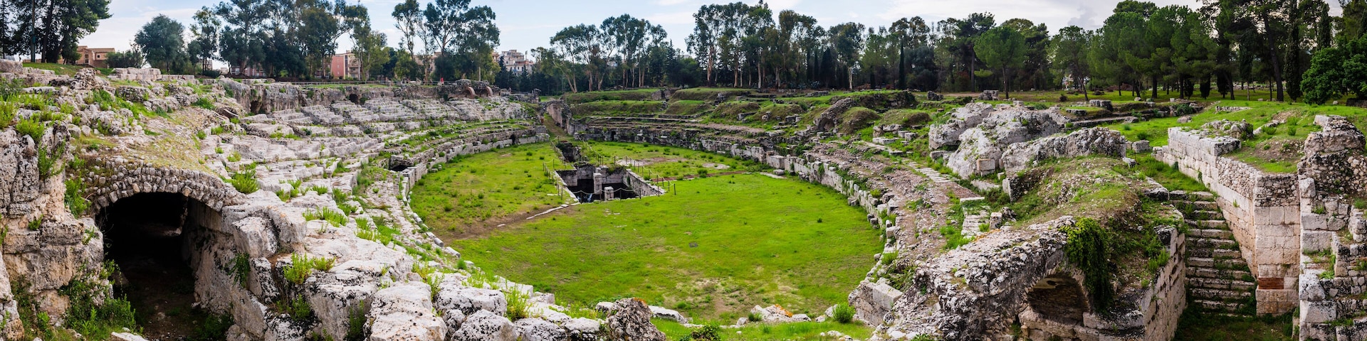 Syracuse, panoramic phot of the Roman Amphitheatre at Syracuse (Siracusa), UNESCO World Heritage Site, Sicily, Italy, Europe