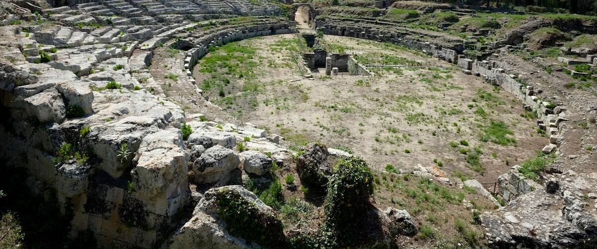 The Roman amphitheatre of Syracuse is one of the best preserved structures in the city of Syracuse, Sicily, from the early Imperial period.
Between the arch and the amphitheatre, there was a monumental fountain, fed by a large cistern which has not yet been identified. A separate cistern provided water to the amphitheatre itself - it is preserved under the nearby church of San Nicola.