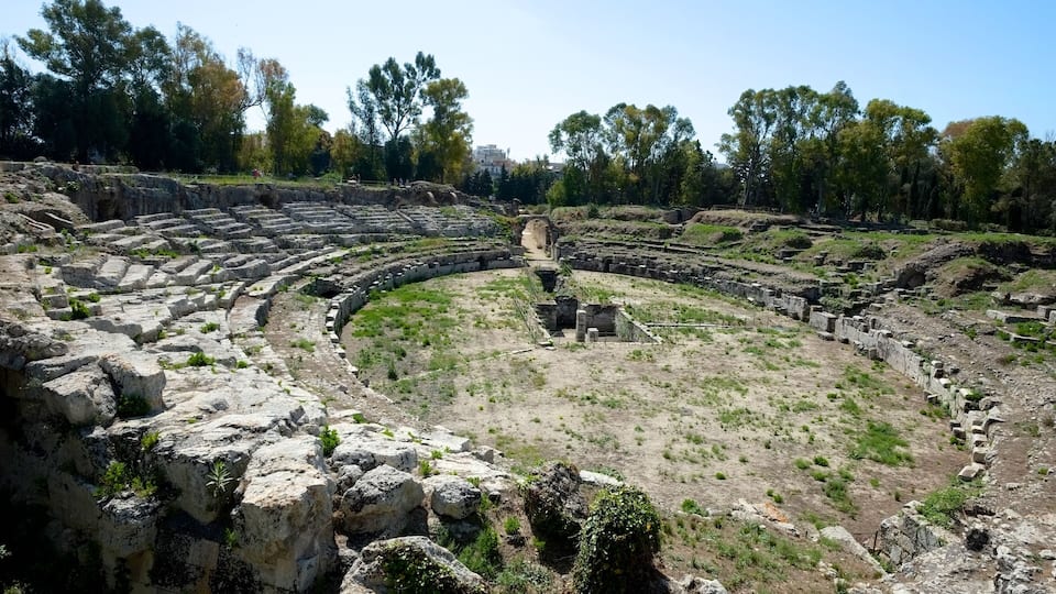 The Roman amphitheatre of Syracuse is one of the best preserved structures in the city of Syracuse, Sicily, from the early Imperial period.
Between the arch and the amphitheatre, there was a monumental fountain, fed by a large cistern which has not yet been identified. A separate cistern provided water to the amphitheatre itself - it is preserved under the nearby church of San Nicola.