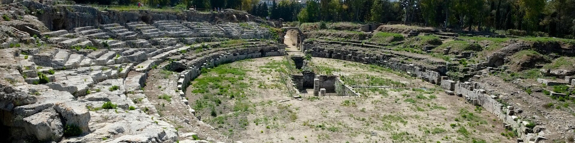 The Roman amphitheatre of Syracuse is one of the best preserved structures in the city of Syracuse, Sicily, from the early Imperial period.
Between the arch and the amphitheatre, there was a monumental fountain, fed by a large cistern which has not yet been identified. A separate cistern provided water to the amphitheatre itself - it is preserved under the nearby church of San Nicola.