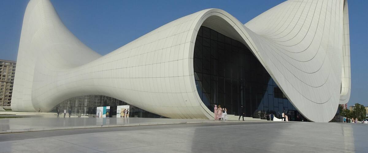 A modern architectural structure with a unique, flowing design.
