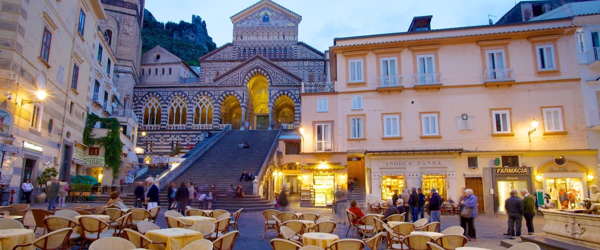 Amalfi showing night scenes, a city and outdoor eating