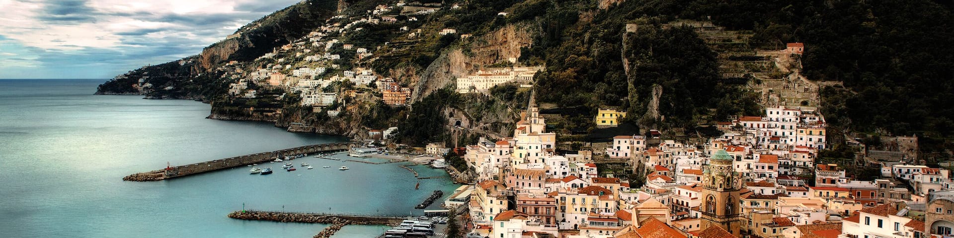 Amalfi has to be lived in to be fully understood, frequenting the winding paths along the alley-ways, up the step steps that lead to the higher part of the town, between the pastel- coloured houses that seem to hang suspended but are set into the rocks.