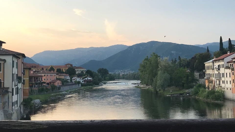 This stunning view is from one of the oldest bridges in Italy. There's a nice bar selling grappa on the bridge. Currently there's restoration work taking place on the bridge. May 2017.