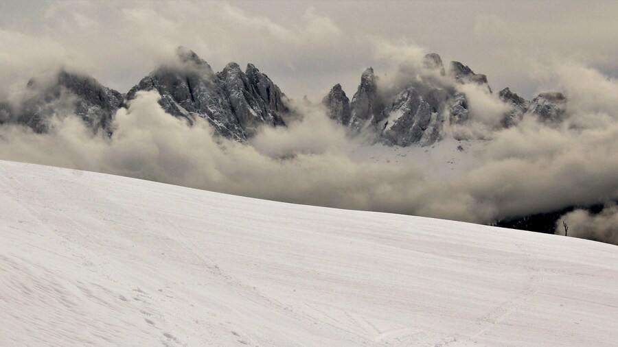I took this in the legendary Dolomites! In Northern Italy, near Brixen/Bressanone. And this was from my last day in the Dolomites. And as far as beauty it was my favorite day! I loved seeing the fog in the mountains and valleys! And the beautiful winter forests :). This was one of my favorite viewpoints up there. I loved how low the fog was hanging! Yet also giving good views of the mountains. It was truly breathtaking to see. And this was only one of many spots around there. A great memory from December 2017!