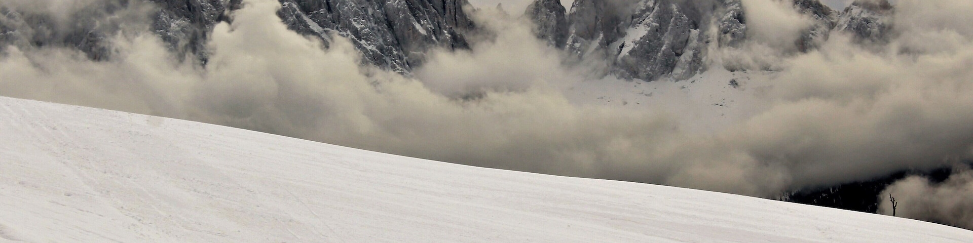 I took this in the legendary Dolomites! In Northern Italy, near Brixen/Bressanone. And this was from my last day in the Dolomites. And as far as beauty it was my favorite day! I loved seeing the fog in the mountains and valleys! And the beautiful winter forests :). This was one of my favorite viewpoints up there. I loved how low the fog was hanging! Yet also giving good views of the mountains. It was truly breathtaking to see. And this was only one of many spots around there. A great memory from December 2017!