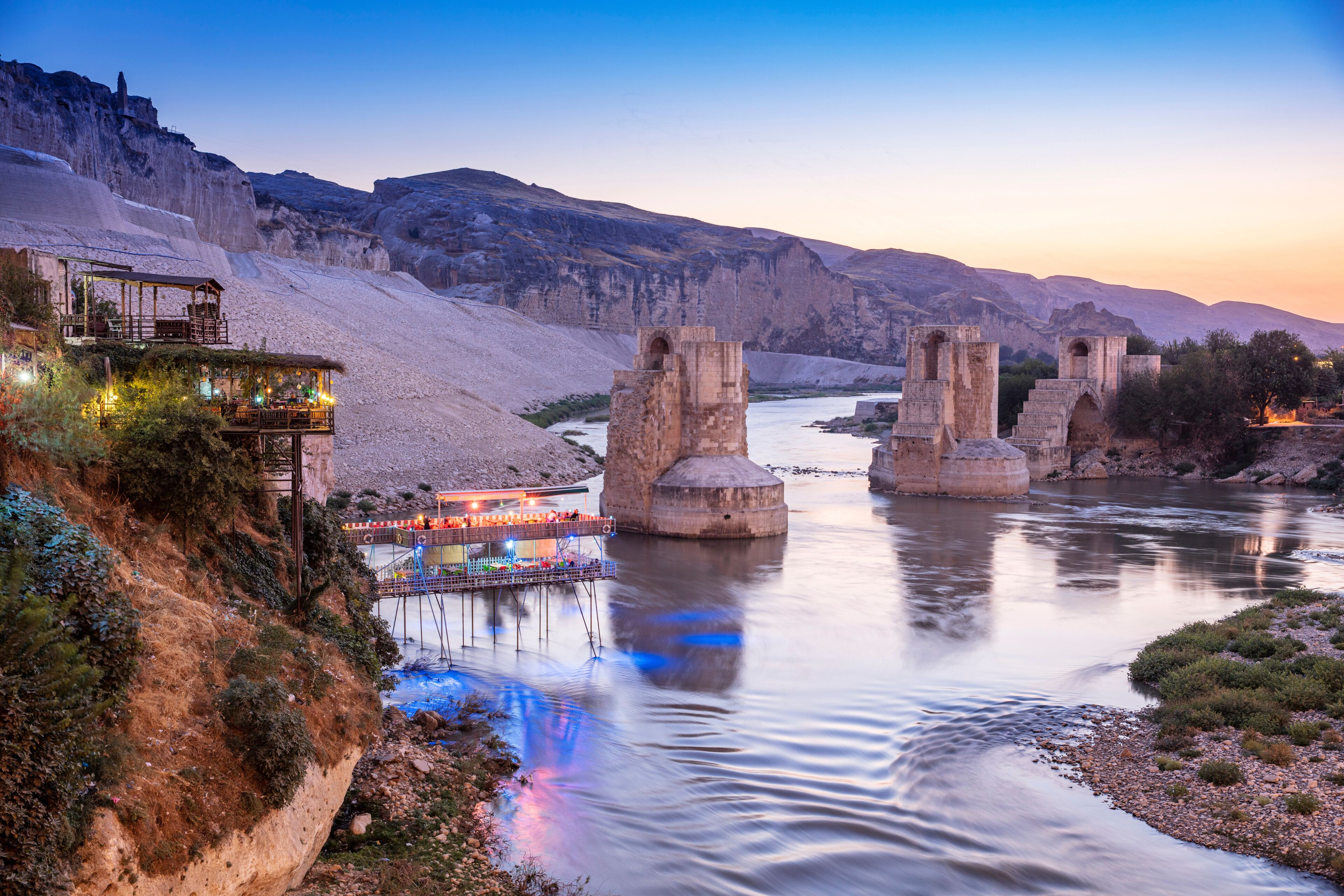 Panoramic view of the Old Tigris Bridge, Castle and minaret in the city of Hasankeyf, Turkey. Batman, Mardin Province