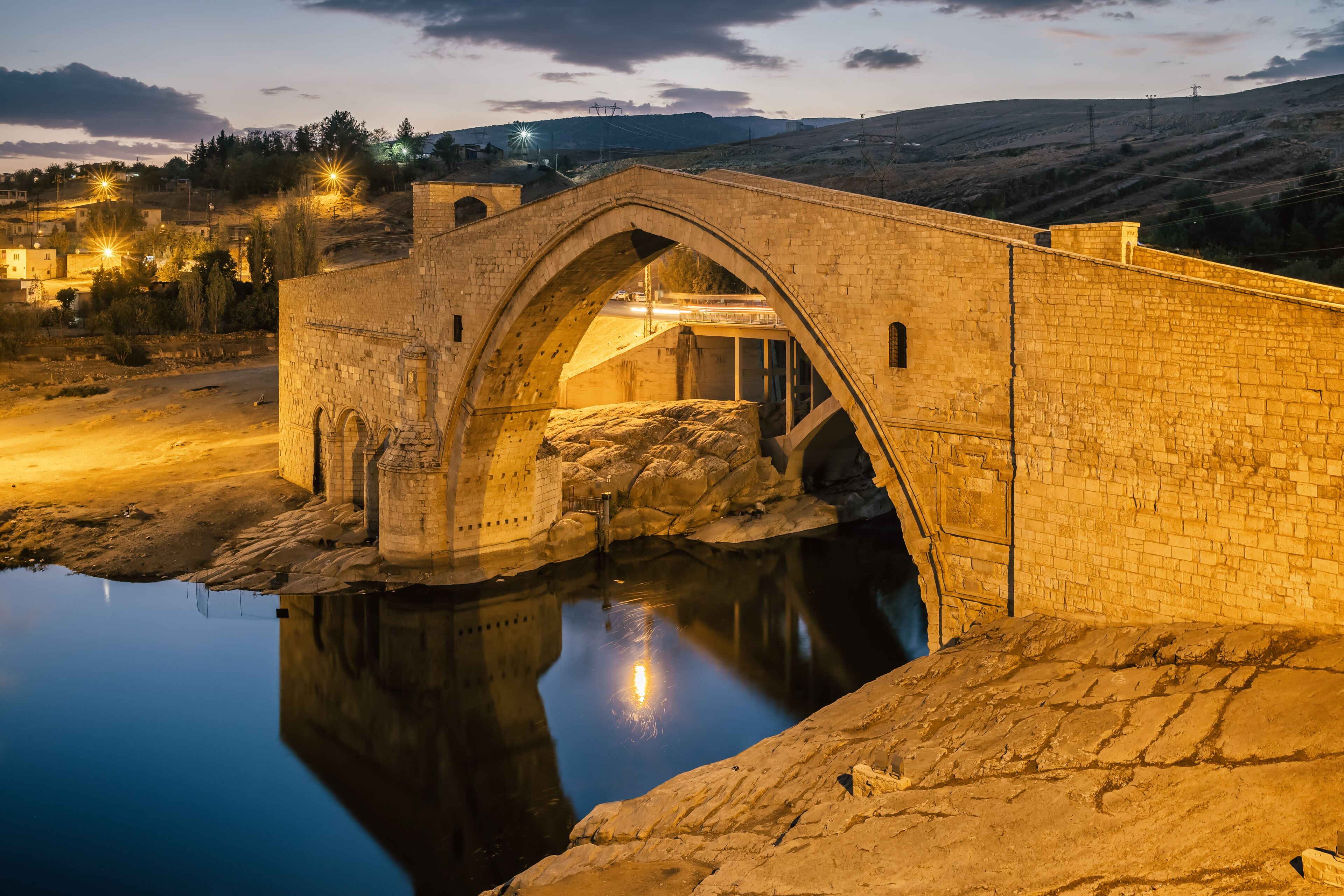 Historic Malabadi Bridge on the Batman river at twilight, Turkey.