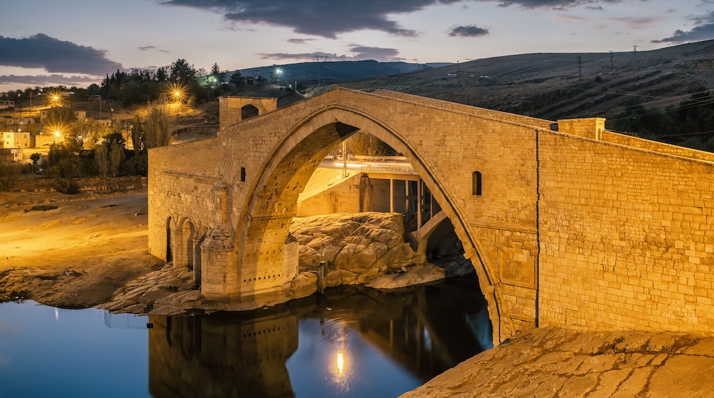 Historic Malabadi Bridge on the Batman river at twilight, Turkey.
