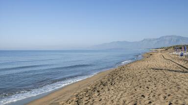Waves and black sand of volcanic origin. Seascape of Baia Domizia, Province of Caserta, Italy