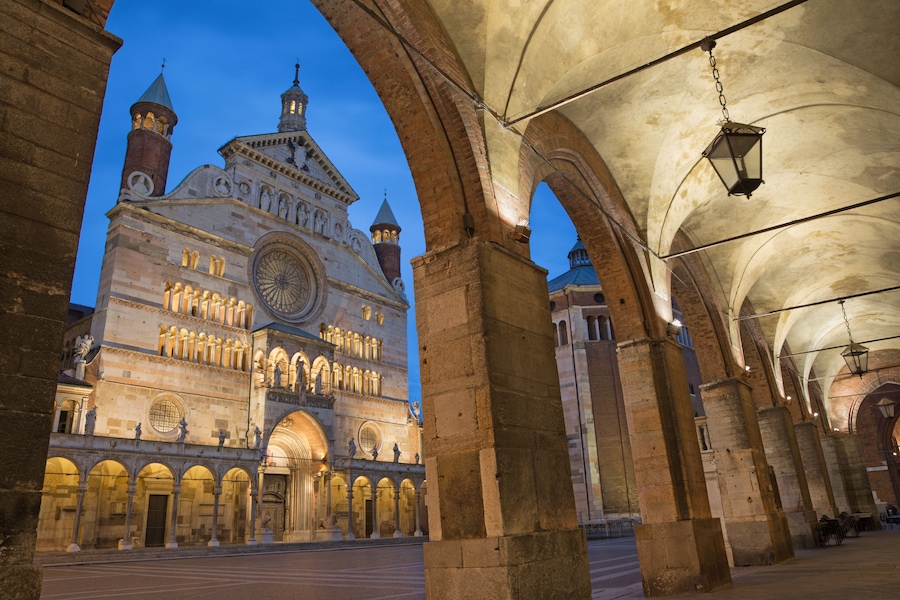 CREMONA, ITALY - MAY 24, 2016: The cathedral Assumption of the Blessed Virgin Mary and the portico of the Town hall at dusk.