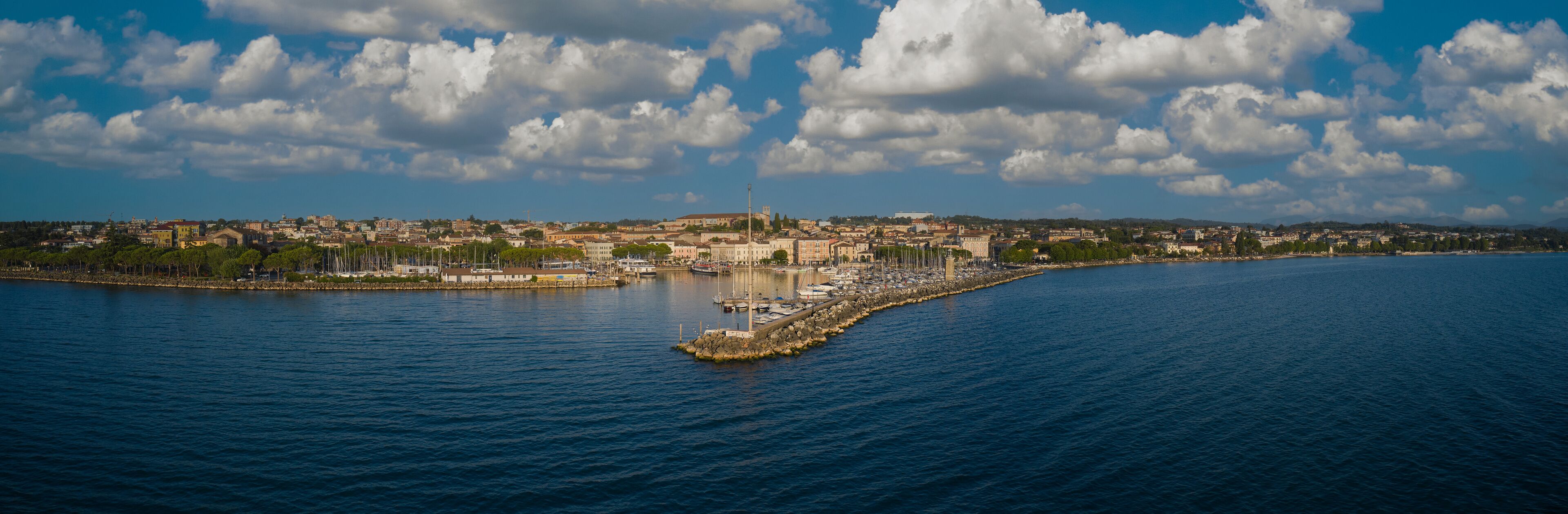 Panorama of the city of Desenzano del Garda on Lake Garda in Italy. Morning city Desenzano del Garda aerial view.