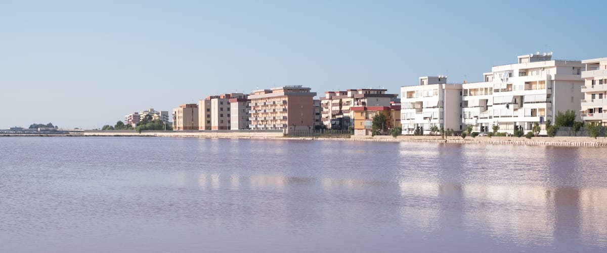 A waterfront with buildings along the shore.