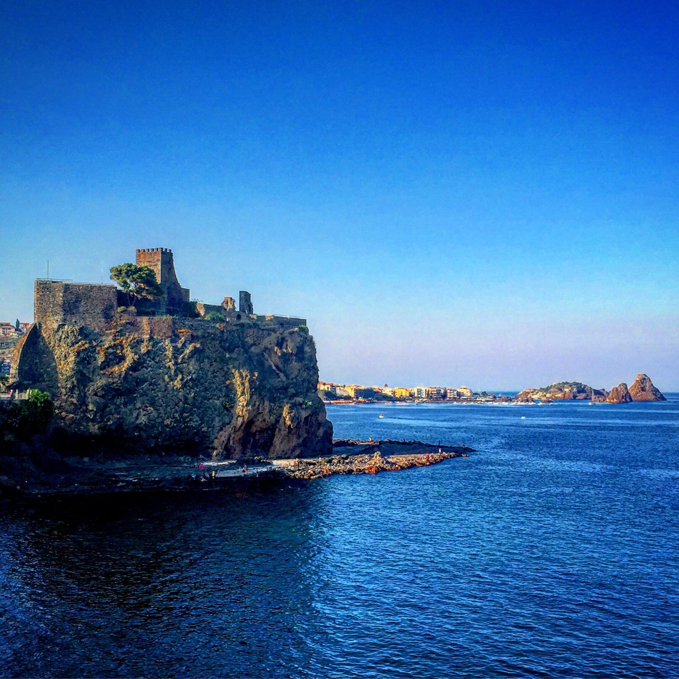 A coastal fortification with a clear view of the surrounding sea and distant islands.