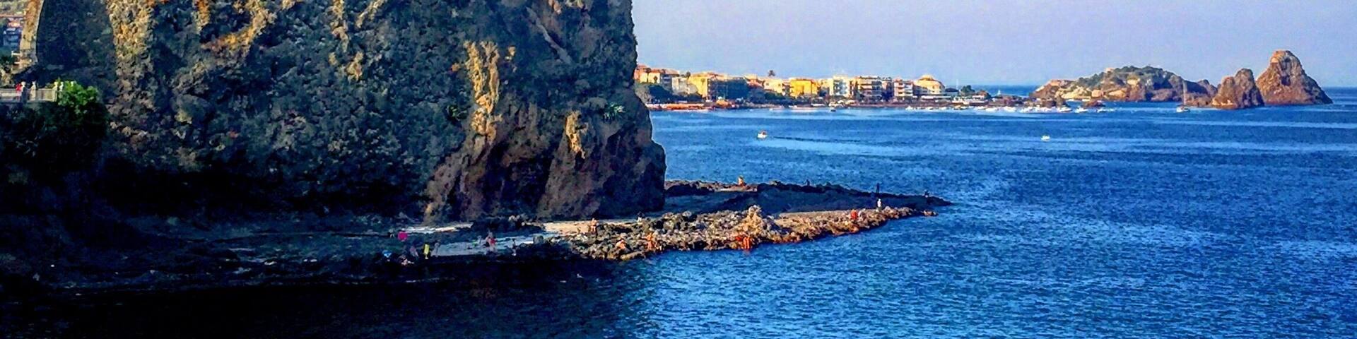 A coastal fortification with a clear view of the surrounding sea and distant islands.