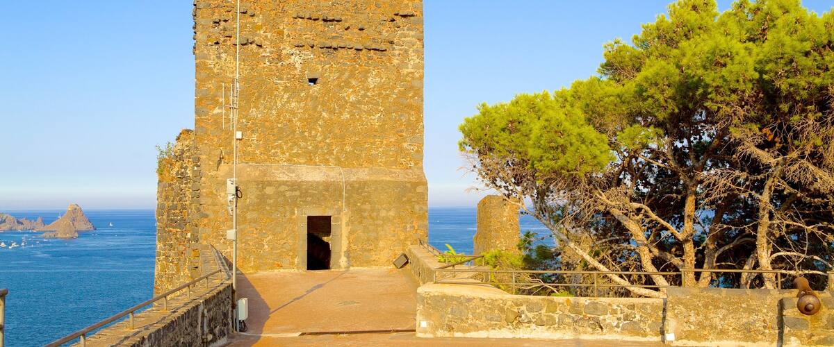 A stone tower with a portcullis, overlooking the sea.