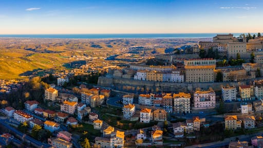 Beautiful aerial scenic view of Guaita fortress on Monte Titano with San Marino city in background at sunrise. Beautiful country of San Marino historical center. Castle on top of the hill.