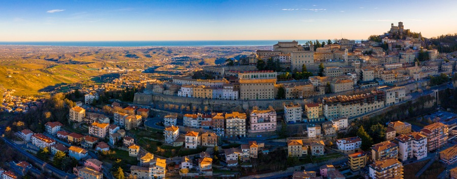 Beautiful aerial scenic view of Guaita fortress on Monte Titano with San Marino city in background at sunrise. Beautiful country of San Marino historical center. Castle on top of the hill.