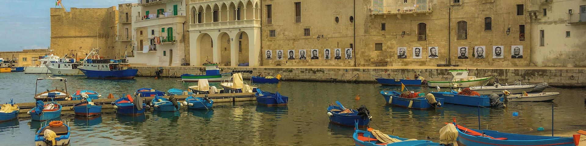 This photo was taken in Monopoli, Italy, during its photography festival, which features exhibits in the steets, abandoned churches and all over town. An amazing unknown destination in Puglia.