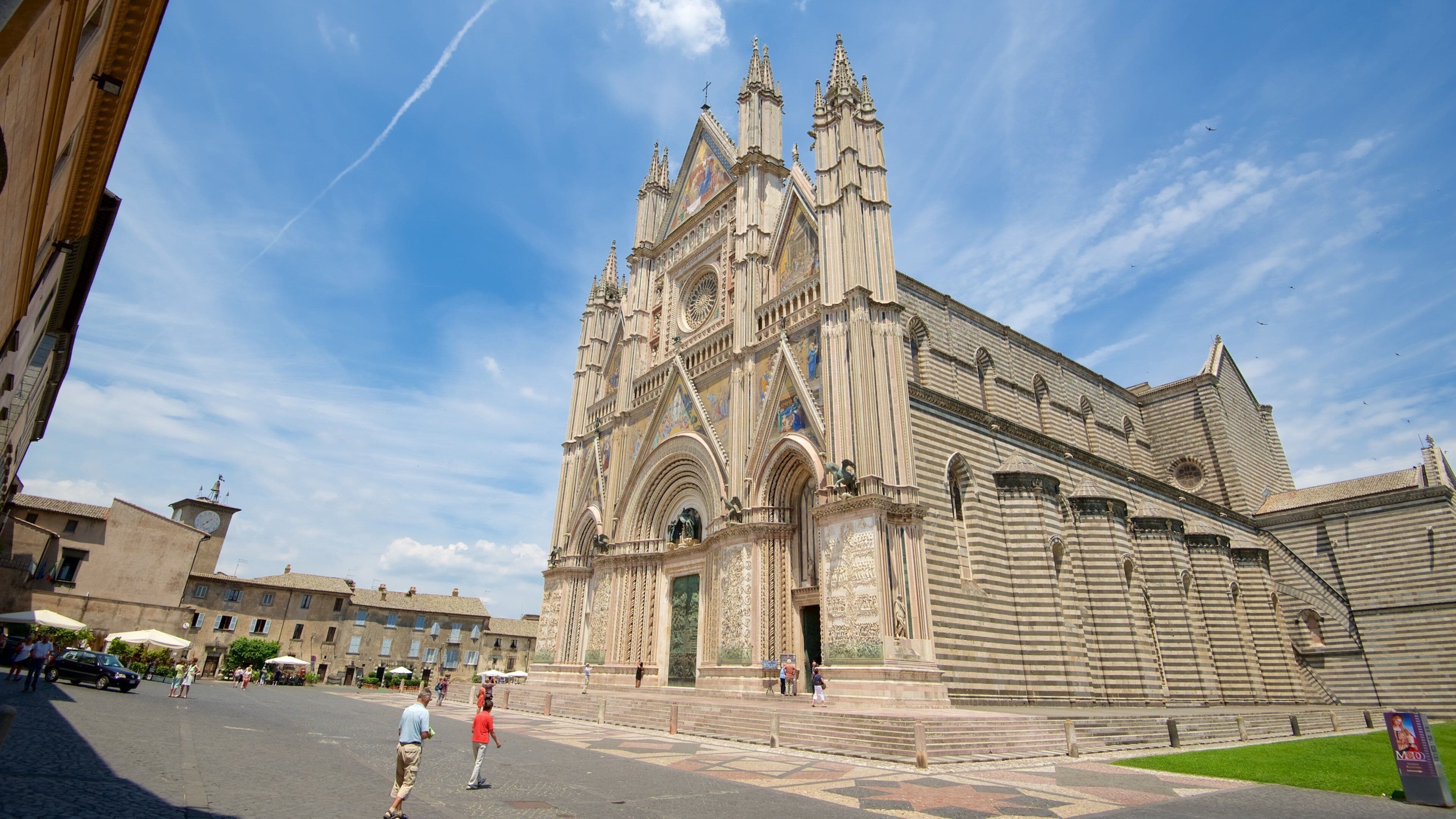 A historic cathedral with intricate architecture and a large clock tower.