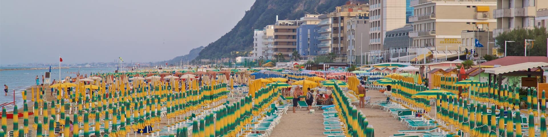 Pesaro which includes general coastal views, a sandy beach and a coastal town