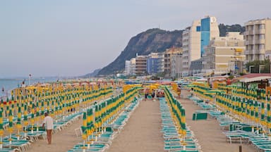 Pesaro which includes general coastal views, a sandy beach and a coastal town