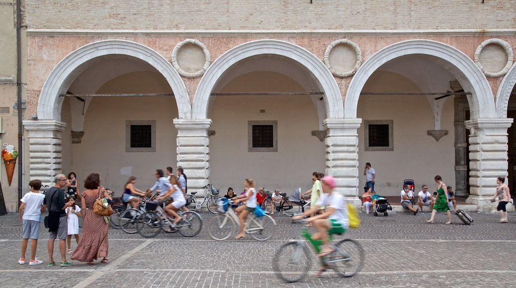 Pesaro which includes cycling and street scenes as well as a small group of people