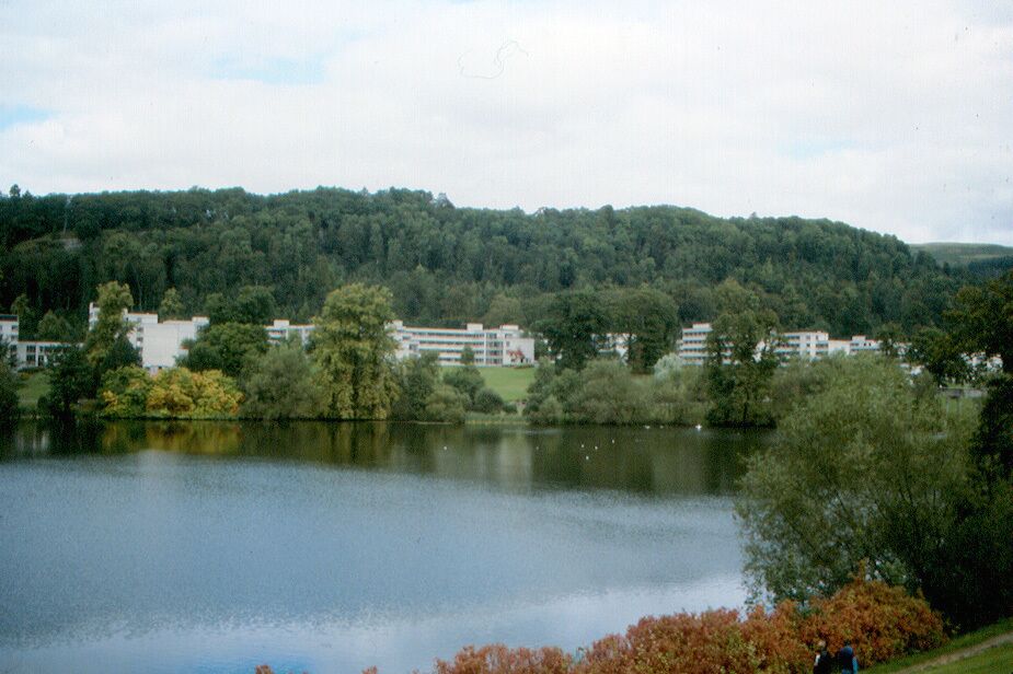 University buildings, probably dormitories, and Airthrey Loch.