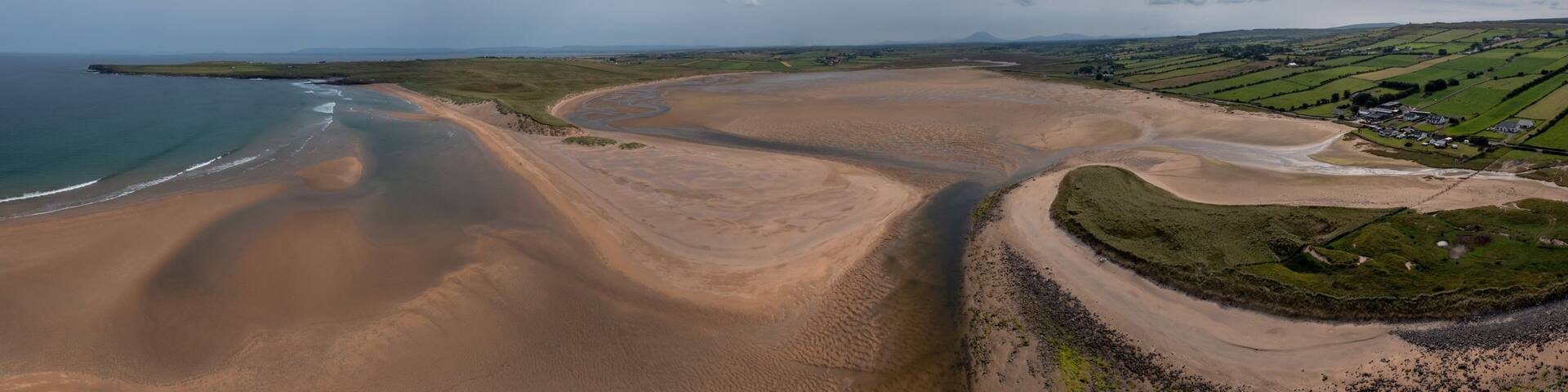 panorama drone landscape view of the beautiful golden sand beach at Lacken Strand on the coast of North Mayo in Ireland