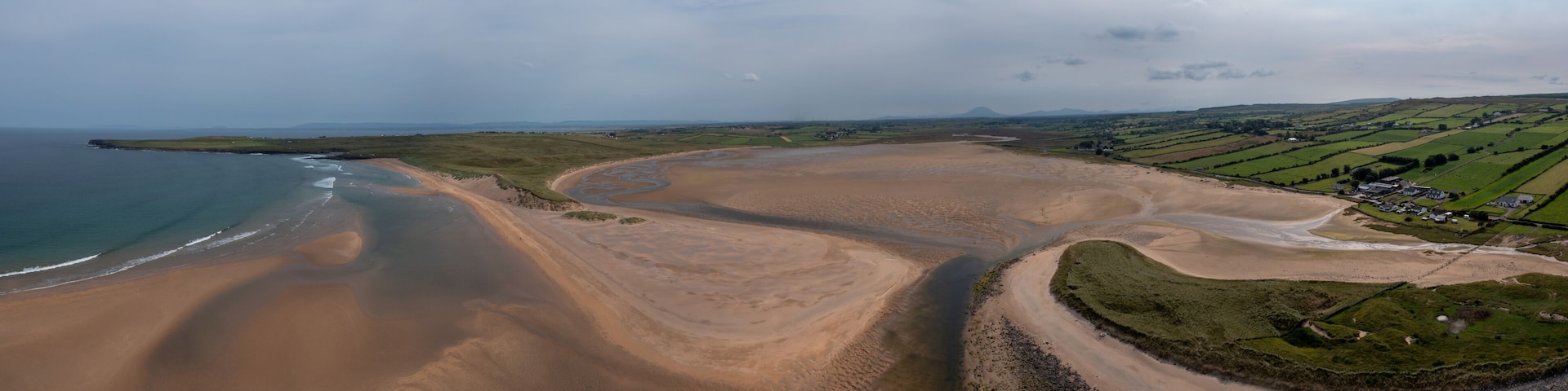 panorama drone landscape view of the beautiful golden sand beach at Lacken Strand on the coast of North Mayo in Ireland