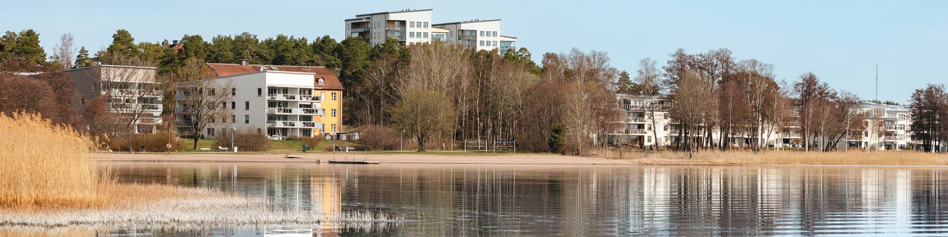 Modern Lakeside Buildings with Reflections in Täby, Sweden