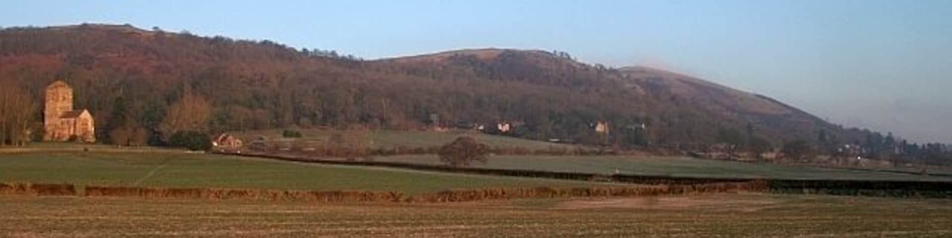 The Fields of Little Malvern A good view across the parish. From Little Malvern Priory to St Wulstans Roman Catholic Church with the Malvern Hills behind.