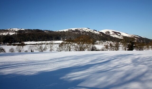 Fields of Little Malvern in the snow Looking from the A4104 towards St. Wulstan's RC church and the Malvern Hills beyond.